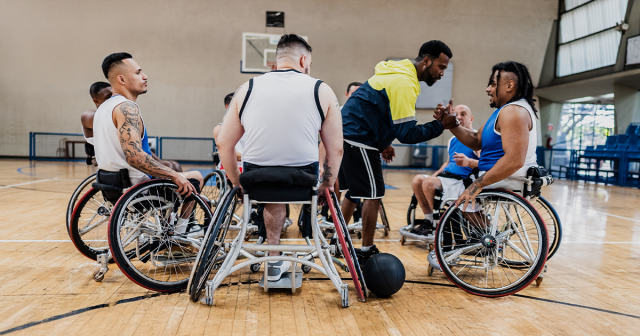 Wheelchair basketball team huddle
