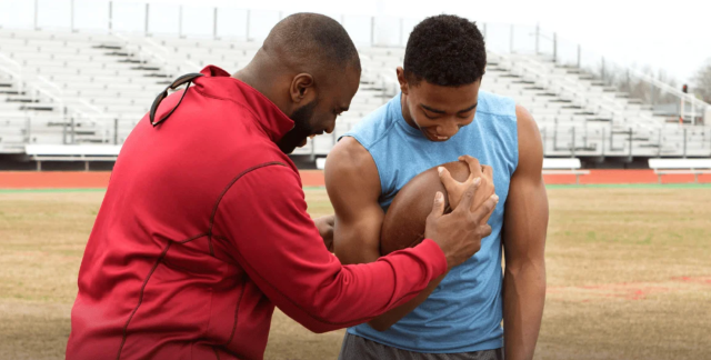 Football coach and athlete